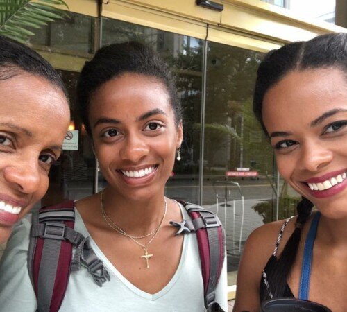 My mom, sister and I (middle) taking a picture in Washington D.C. before starting the day Svg+xml,%3Csvg%20xmlns%3D%22http%3A%2F%2Fwww.w3